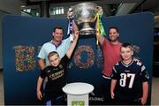 30 August 2019; 10 year old Charlie O'Connor, left, with dad Ken O'Connor, and 11 year old Ken Jr. O'Connor, right, with Ray O'Connor, from Glencar, Co. Kerry, back from New York to watch the All-Ireland Final, with the Sam Maguire Cup at the GAA’s Home for the Match stand in the arrivals hall at Dublin Airport. Photo by Matt Browne/Sportsfile