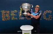 30 August 2019; Karl Cleary from Beaumont, Dublin, back from Croatia to watch the All Ireland Final, with the Sam Maguire Cup at the GAA’s Home for the Match stand in the arrivals hall at Dublin Airport. Photo by Matt Browne/Sportsfile