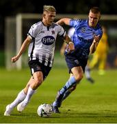 30 August 2019; Seán Murray of Dundalk in action against Jack Keaney of UCD during the SSE Airtricity League Premier Division match between UCD and Dundalk at The UCD Bowl in Belfield, Dublin. Photo by Ben McShane/Sportsfile