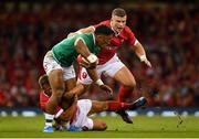 31 August 2019; Bundee Aki of Ireland is tackled by Scott Williams, right, and Jarrod Evans of Wales during the Under Armour Summer Series 2019 match between Wales and Ireland at the Principality Stadium in Cardiff, Wales. Photo by Brendan Moran/Sportsfile