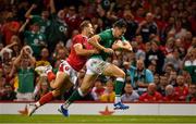 31 August 2019; Jacob Stockdale of Ireland on the way to scoring his side's second try despite the tackle of Hallam Amos of Wales during the Under Armour Summer Series 2019 match between Wales and Ireland at the Principality Stadium in Cardiff, Wales. Photo by Brendan Moran/Sportsfile