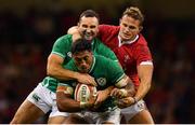31 August 2019; Bundee Aki of Ireland, centre, supported by team-mate Dave Kearney, is tackled by Hallam Amos of Wales during the Under Armour Summer Series 2019 match between Wales and Ireland at the Principality Stadium in Cardiff, Wales. Photo by Brendan Moran/Sportsfile