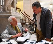 31 August 2019; Author Iain Maclean, left, signs copies of The Liffey Descent for guests during its launch at City Hall in Dublin. Photo by Seb Daly/Sportsfile