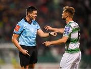 30 August 2019; Referee Robert Hennessy and Greg Bolger of Shamrock Rovers during the SSE Airtricity League Premier Division match between Shamrock Rovers and Bohemians at Tallaght Stadium in Dublin. Photo by Stephen McCarthy/Sportsfile