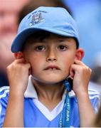 1 September 2019; A young Dublin supporter watches the final moments of the GAA Football All-Ireland Senior Championship Final match between Dublin and Kerry at Croke Park in Dublin. Photo by Brendan Moran/Sportsfile