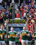 1 September 2019; Cork captain Conor Corbett lifts the Tom Markham Cup after the Electric Ireland GAA Football All-Ireland Minor Championship Final match between Cork and Galway, as Kerry make their way onto the pitch for the senior final against Dublin, at Croke Park in Dublin. Photo by Piaras Ó Mídheach/Sportsfile