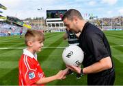 1 September 2019; Referee Noel Mooney is presented with the match ball by Gearóid Linehan, Ballyhass NS, Castlemagner, Co, Cork, before the Electric Ireland GAA Football All-Ireland Minor Championship Final match between Cork and Galway at Croke Park in Dublin. Photo by Piaras Ó Mídheach/Sportsfile
