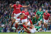 7 September 2019; Bundee Aki of Ireland in action against Jonathan Davies, left, and Jonathan Davies of Wales, below, during the Guinness Summer Series match between Ireland and Wales at the Aviva Stadium in Dublin. Photo by Ramsey Cardy/Sportsfile