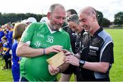 7 September 2019; Dementia advocate Kevin Quaid gives Kilkenny referee Seán Cleere a suspicious brown Envelope before The Alzheimer Society of Ireland hosting Bluebird Care sponsored Tipperary v Limerick hurling fundraiser match at Nenagh Éire Óg, Nenagh, Co Tipperary. This unique fundraising initiative, to mark World Alzheimer’s Month 2019, was the brainchild of two leading Munster dementia advocates, Kevin Quaid and Kathy Ryan, who both have a dementia diagnosis. All the money raised will go towards providing community services and advocacy supports in the Munster area and beyond. Photo by Piaras Ó Mídheach/Sportsfile