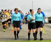 8 September 2019; Referee Sarah Dyas, centre, and her assistants Timara Lawless, left, and Olivia Sneyd leads the players out prior to the FAI Women’s Intermediate Shield Final match between Manulla FC and Whitehall Rangers at Mullingar Athletic FC in Mullingar, Co. Westmeath. Photo by Seb Daly/Sportsfile