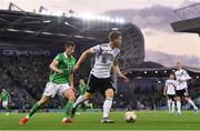 9 September 2019; Marcel Halstenberg of Germany in action against Paddy McNair of Northern Ireland during the UEFA EURO2020 Qualifier Group C match between Northern Ireland and Germany at the National Stadium at Windsor Park in Belfast. Photo by Ramsey Cardy/Sportsfile