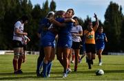 14 September 2019; Megan Williams, centre, of Leinster celebrates after scoring her side's third try with team-mates Sene Naoupu, right, and Linda Djougang during the Women’s Interprovincial Championship Semi-Final match between Leinster and Ulster at St Mary's RFC in Templeogue, Dublin. Photo by Ben McShane/Sportsfile