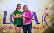14 September 2019; Marie Hickey, President, LGFA,  makes a presentation to the Captain of Bryansford, Co Down runners-up in the Senior Shield Final to Claregalway, Co Galway during the 2019 LGFA All-Ireland Club 7s at Naomh Mearnóg & St Sylvesters in Dublin. Photo by Michael P Ryan/Sportsfile