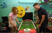 15 September 2019; Kate Cullivan, age 11, from Naas, Co Kildare plays a game of table football with Dublin player Rob McDaid on a visit by the All-Ireland Senior Football Champions to the Children's Health Ireland at Crumlin in Dublin. Photo by David Fitzgerald/Sportsfile