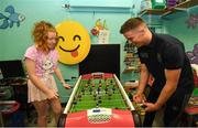 15 September 2019; Kate Cullivan, age 11, from Naas, Co Kildare plays a game of table football with Dublin player Rob McDaid on a visit by the All-Ireland Senior Football Champions to the Children's Health Ireland at Crumlin in Dublin. Photo by David Fitzgerald/Sportsfile