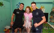 15 September 2019; Kate Cullivan, age 11, from Naas, Co Kildare pictured with Dublin players Brian Howard, left, and Rob McDaid on a visit by the All-Ireland Senior Football Champions to the Children's Health Ireland at Crumlin in Dublin. Photo by David Fitzgerald/Sportsfile