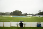 15 September 2019; A spectator awaits the decision from the umpires regarding play prior to the T20 International Tri Series match between Ireland and Netherlands at Malahide Cricket Club in Dublin. Photo by Eóin Noonan/Sportsfile