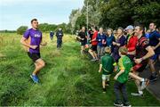 14 September 2019; David Gillick with Participants pictured at the Navan parkrun at Blackwater Park, in Navan, Co. Meath, where Vhi hosted a special event to celebrate their partnership with parkrun Ireland. Vhi ambassador and Olympian David Gillick was on hand to lead the warm up for parkrun participants before completing the 5km free event. Parkrunners enjoyed refreshments post event at the Vhi Rehydrate, Relax, Refuel and Reward areas. Parkrun in partnership with Vhi support local communities in organising free, weekly, timed 5k runs every Saturday at 9.30am. To register for a parkrun near you visit www.parkrun.ie.  Photo by Matt Browne/Sportsfile