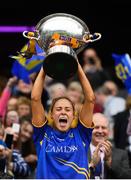 15 September 2019; Tipperary captain Samantha Lambert lifts the Mary Quinn Memorial Cup following the TG4 All-Ireland Ladies Football Intermediate Championship Final match between Meath and Tipperary at Croke Park in Dublin. Photo by Stephen McCarthy/Sportsfile