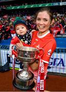 15 September 2019; Louth's Susan Byrne celebrates with Senan Byrne and the West County Hotel Cup following the TG4 All-Ireland Ladies Football Junior Championship Final match between Fermanagh and Louth at Croke Park in Dublin. Photo by Stephen McCarthy/Sportsfile
