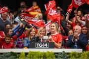 15 September 2019; LGFA President Marie Hickey presents the West County Hotel Cup to Louth captain Kate Flood following the TG4 All-Ireland Ladies Football Junior Championship Final match between Fermanagh and Louth at Croke Park in Dublin. Photo by Stephen McCarthy/Sportsfile