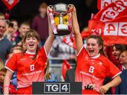 15 September 2019; Lauren Boyle, left, and Niamh Rice of Louth lift the West County Hotel Cup following the TG4 All-Ireland Ladies Football Junior Championship Final match between Fermanagh and Louth at Croke Park in Dublin. Photo by Stephen McCarthy/Sportsfile