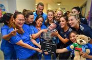 16 September 2019; Dublin ladies footballers including Hannah O'Neill, centre, and Lyndsey Davey, left, with nurses and James Ryan, age 6 months, inside the Brendan Martin cup during the TG4 All-Ireland Senior Ladies Football Champions visit to Our Lady’s Children’s Hospital in Crumlin, Co Dublin. Photo by David Fitzgerald/Sportsfile