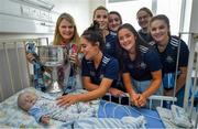 16 September 2019; Dublin footballer Hannah O'Neill, centre, and team-mates meet Brid O'Connell and her son Geoff McGovern, age 2 months, from Ballinteer, Co Dublin during the TG4 All-Ireland Senior Ladies Football Champions visit to Our Lady’s Children’s Hospital in Crumlin, Co Dublin. Photo by David Fitzgerald/Sportsfile