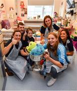 16 September 2019; Dublin ladies footballers, from left, Lyndsey Davey, Ciara Trant, Muireann Ní Scanaill and Sarah Fagan with Holly Carroll, age 4, and her father Jamie, from Co Tipperary during the TG4 All-Ireland Senior Ladies Football Champions visit to Our Lady’s Children’s Hospital in Crumlin, Co Dublin. Photo by David Fitzgerald/Sportsfile