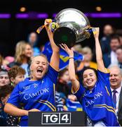 15 September 2019; Tipperary's Anna Carey, left, and Angela McGuigan lift the Mary Quinn Memorial Cup following the TG4 All-Ireland Ladies Football Intermediate Championship Final match between Meath and Tipperary at Croke Park in Dublin. Photo by Stephen McCarthy/Sportsfile