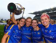 15 September 2019; Tipperary players, from left, Anna Rose Kennedy, Samantha Lambert, Maria Curley and Orla O'Dwyer celebrate with the Mary Quinn Memorial Cup following the TG4 All-Ireland Ladies Football Intermediate Championship Final match between Meath and Tipperary at Croke Park in Dublin. Photo by Stephen McCarthy/Sportsfile