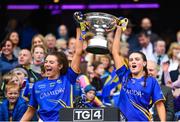 15 September 2019; Tipperary's Orla Winston, left, and Ava Fennessey lift the Mary Quinn Memorial Cup following the TG4 All-Ireland Ladies Football Intermediate Championship Final match between Meath and Tipperary at Croke Park in Dublin. Photo by Stephen McCarthy/Sportsfile