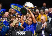 15 September 2019; Tipperary's Niamh Lonergan lifts the Mary Quinn Memorial Cup following the TG4 All-Ireland Ladies Football Intermediate Championship Final match between Meath and Tipperary at Croke Park in Dublin. Photo by Stephen McCarthy/Sportsfile