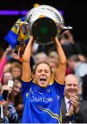15 September 2019; Tipperary captain Samantha Lambert lifts the the Mary Quinn Memorial Cup following the TG4 All-Ireland Ladies Football Intermediate Championship Final match between Meath and Tipperary at Croke Park in Dublin. Photo by Stephen McCarthy/Sportsfile