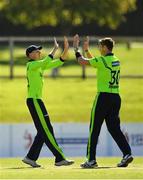 17 September 2019; Boyd Rankin of Ireland, right, is congratulated by team-mate Lorcan Tucker after claiming the wicket of Michael Leask of Scotland during the T20 International Tri Series match between Ireland and Scotland at Malahide Cricket Club in Dublin. Photo by Seb Daly/Sportsfile