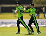 17 September 2019; Shane Getkate of Ireland, left, is congratulated by team-mate Lorcan Tucker after catching out George Munsey of Scotland during the T20 International Tri Series match between Ireland and Scotland at Malahide Cricket Club in Dublin. Photo by Seb Daly/Sportsfile