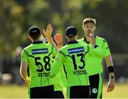 17 September 2019; Boyd Rankin of Ireland, right, is congratulated by team-mates Shane Getkate, left, and Harry Tector, centre, after claiming the wicket of Oliver Hairs of Scotland during the T20 International Tri Series match between Ireland and Scotland at Malahide Cricket Club in Dublin. Photo by Seb Daly/Sportsfile