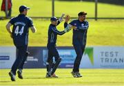 17 September 2019; Hamza Tahir of Scotland, right, is congratulated by team-mate Matthew Cross after claiming the wicket of Kevin O’Brien of Ireland during the T20 International Tri Series match between Ireland and Scotland at Malahide Cricket Club in Dublin. Photo by Seb Daly/Sportsfile