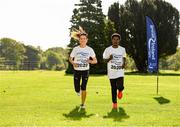 18 September 2019; Grace Lynch of Iveragh A.C. and Hiko Tonosa of Dundrum South Dublin A.C. during the 2020 Great Ireland Run Launch at Phoenix Park in Dublin. Photo by Eóin Noonan/Sportsfile