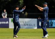 19 September 2019; Hamza Tahir, left, and Adrian Neill of Scotland celebrate the wicket of Pieter Seelaar of Netherlands during the T20 International Tri Series match between Scotland and Netherlands at Malahide Cricket Club in Dublin. Photo by Harry Murphy/Sportsfile