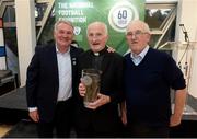 19 September 2019; Fr Michael Sweeney, a founding member of Fanad United, the Donegal League and Ulster Senior League, after being presented with a National Football Exhibition Grassroots Hero award, with former Republic of Ireland International Ray Houghton, left, and Jim McConnell from Buncrana, right, at the National Football Exhibition launch in the Regional Cultural Centre, Letterkenny, Donegal. Photo by Oliver McVeigh/Sportsfile