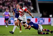 20 September 2019; Pieter Labuschagne of Japan escapes a tackle of Yury Kushnarev of Russia on his way to scoring his side's third try during the 2019 Rugby World Cup Pool A match between Japan and Russia at the Tokyo Stadium in Chofu, Japan. Photo by Brendan Moran/Sportsfile