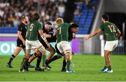 21 September 2019; Ardie Savea of New Zealand is tackled by Pieter-Steph du Toit of South Africa during the 2019 Rugby World Cup Pool B match between New Zealand and South Africa at the International Stadium in Yokohama, Japan. Photo by Ramsey Cardy/Sportsfile