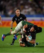 21 September 2019; Ardie Savea of New Zealand is tackled by, Siya Kolisi and Faf de Klerk of South Africa, during the 2019 Rugby World Cup Pool B match between New Zealand and South Africa at the International Stadium in Yokohama, Japan. Photo by Ramsey Cardy/Sportsfile