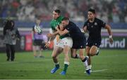 22 September 2019; Chris Farrell of Ireland releases a pass in the build up to Ireland's fourth try despite the tackle of Finn Russell of Scotland during the 2019 Rugby World Cup Pool A match between Ireland and Scotland at the International Stadium in Yokohama, Japan. Photo by Brendan Moran/Sportsfile