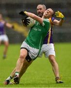 22 September 2019; Peter Lynch of Roslea Shamrocks in action against Kevin Cassidy of Derrygonnelly Harps during the Fermanagh County Senior Club Football Championship Final match between Derrygonnelly Harps and Roslea Shamrocks at Brewster Park in Enniskillen, Fermanagh. Photo by Oliver McVeigh/Sportsfile