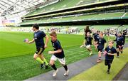 22 September 2019; Aviva Ireland gave 400 children the dream opportunity to take part in the Aviva Mini Nations Cup in Aviva Stadium on Sunday, September 22. 20 U10 boys’ and U12 girls’ teams from clubs nationwide took to the hallowed pitch after Ireland’s heroic win over Scotland in Japan for their very own Mini Rugby Nations Cup. See aviva.ie/safetodream or @AvivaIreland social channels for details. Players from Longford RFC representing USA taking part in the parade during the Aviva Mini Rugby Nations Cup at Aviva Stadium in Dublin. Photo by Eóin Noonan/Sportsfile