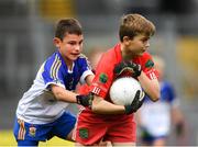 24 September 2019; Fiontan Muldoon of St James', Co. Antrim, in action against Conor O'Connell,  St Brigids Belfast, Co. Antrim, during the Littlewoods Ireland Ulster GAA Go Games Provincial Days’ in Croke Park in Dublin. This year over 6,000 boys and girls aged between six and twelve represented their clubs in a series of mini blitzes and – just like their heroes – got to play in Croke Park.  Photo by Harry Murphy/Sportsfile