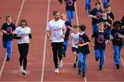 23 September 2019; Athletics Ireland and Dublin City Sport & Wellbeing Partnership are calling on all primary schools in the Dublin City area to sign up to The Daily Mile! Our aim is to get as many schools as possible signed up in the month of September. Pictured are Irish Athletes Ger O’Donnell, Nadia Power and children from Bayside National School and Star Of the Sea, Ringsend, at The Daily Mile Dublin City Schools launch at the Irishtown Stadium in Dublin. Photo by Harry Murphy/Sportsfile