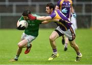 22 September 2019; Niall Beggan of Roslea Shamrocks in action against Michael Jones of Derrygonnelly Harps during the Fermanagh County Senior Club Football Championship Final match between Derrygonnelly Harps and Roslea Shamrocks at Brewster Park in Enniskillen, Fermanagh. Photo by Oliver McVeigh/Sportsfile